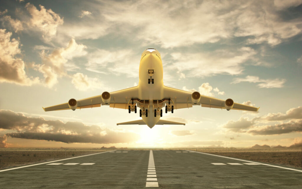 Very high resolution 3d rendering of an airplane taking off at sunset